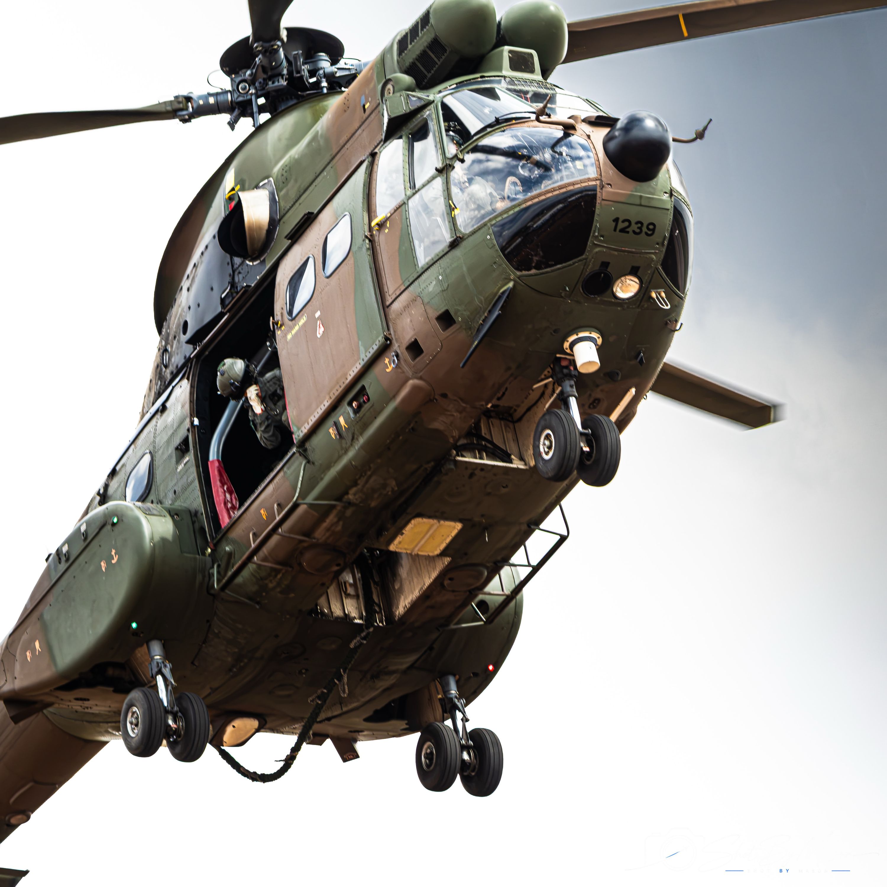 Camouflage Military Helicopter in Flight. Photograph by Mason Stretch